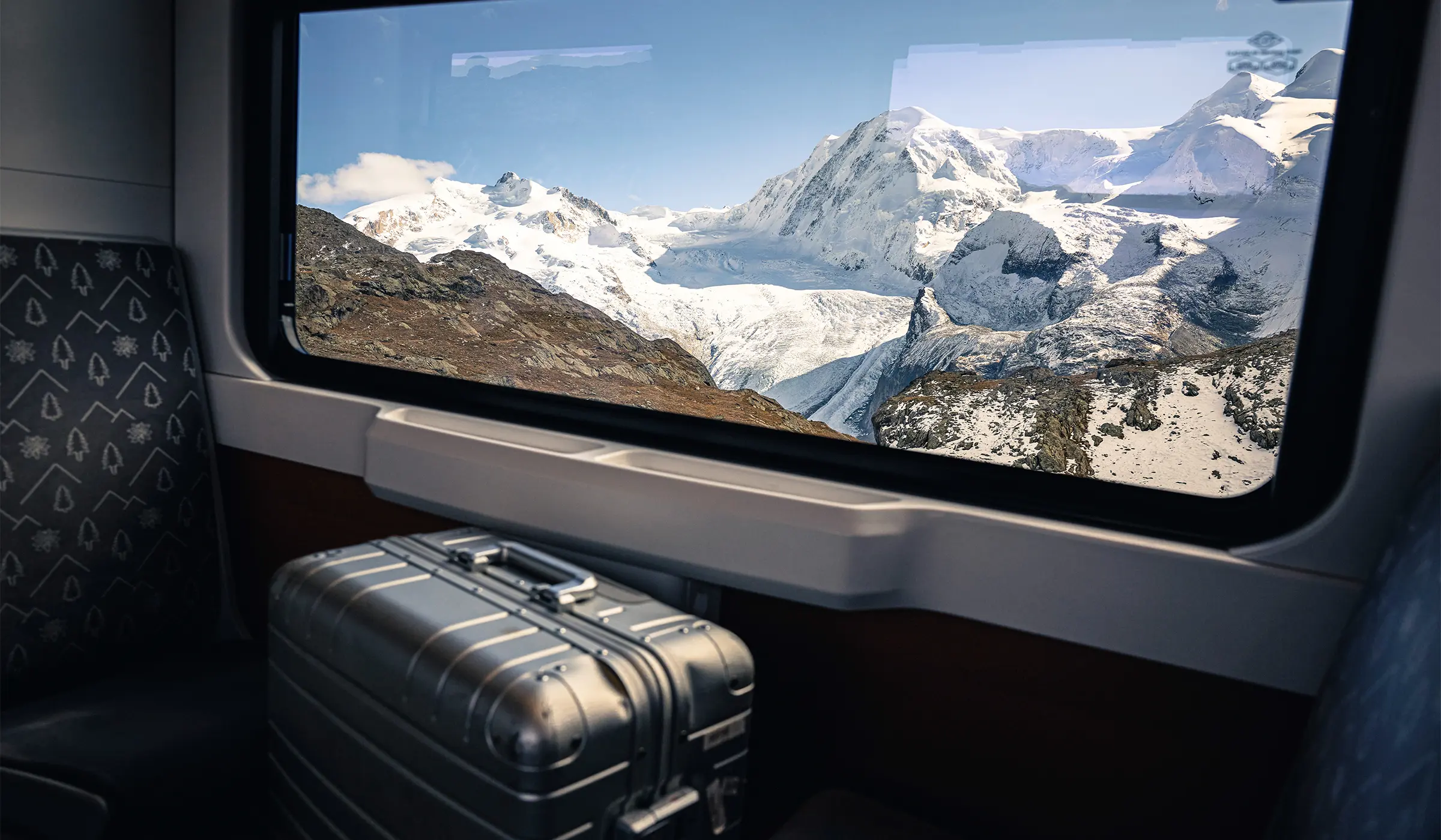Suitcase in mountain railway