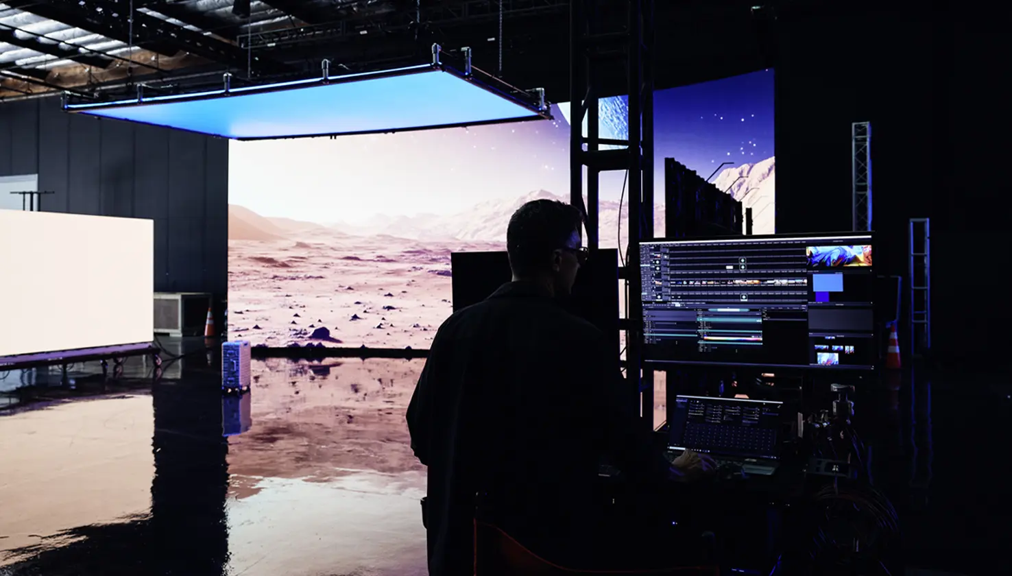 View into a studio with a film setup and LED screens
