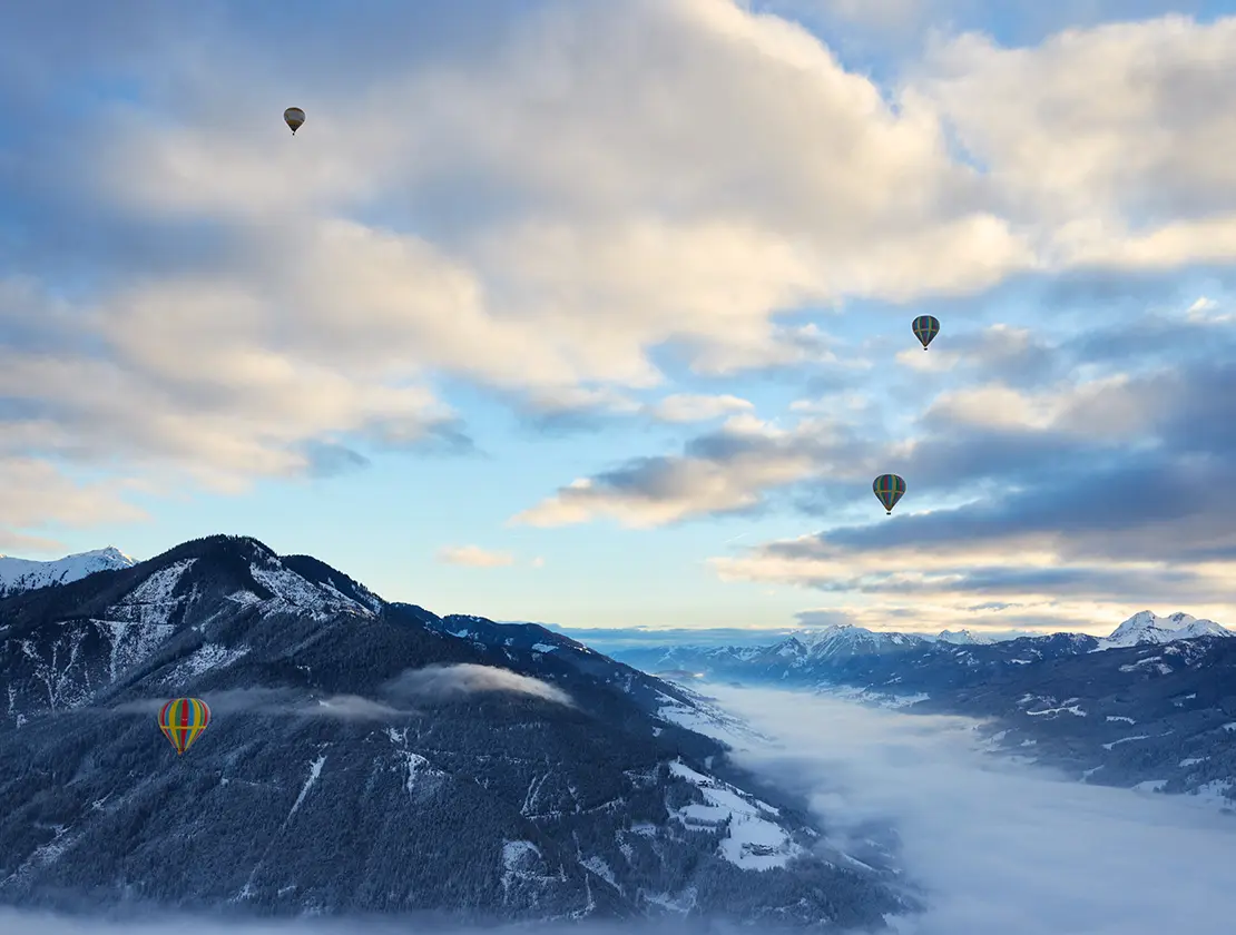 Balloons floating over the Alps