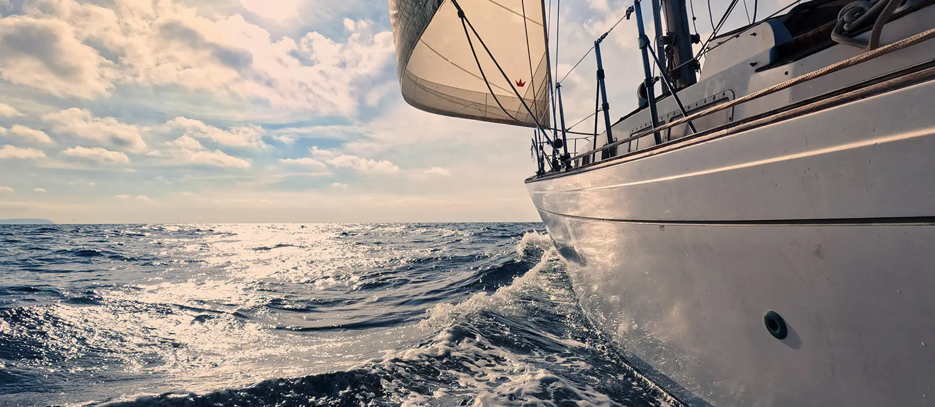 Sailboat travelling through waves