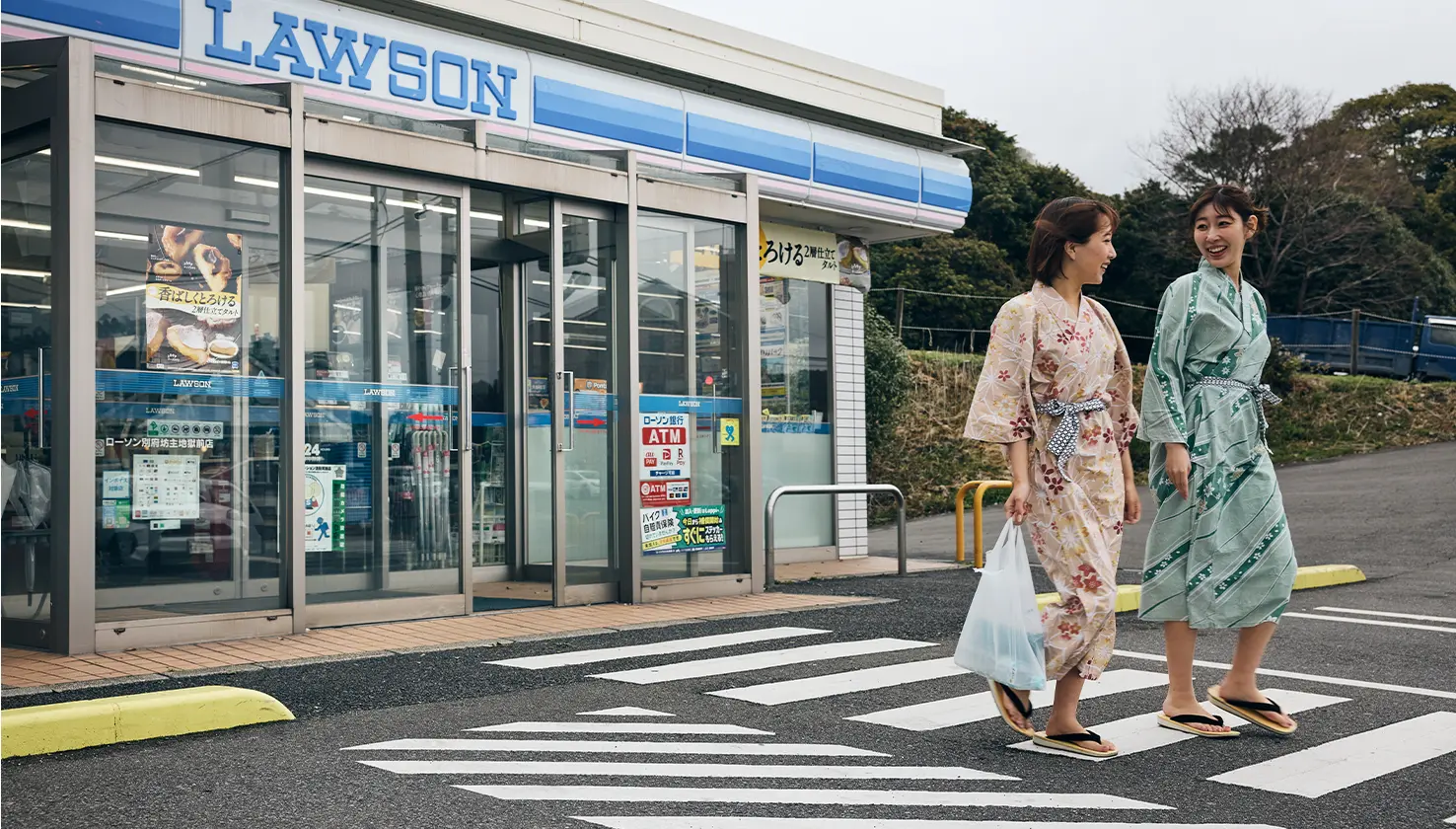 Two women in front of a supermarket in Japan