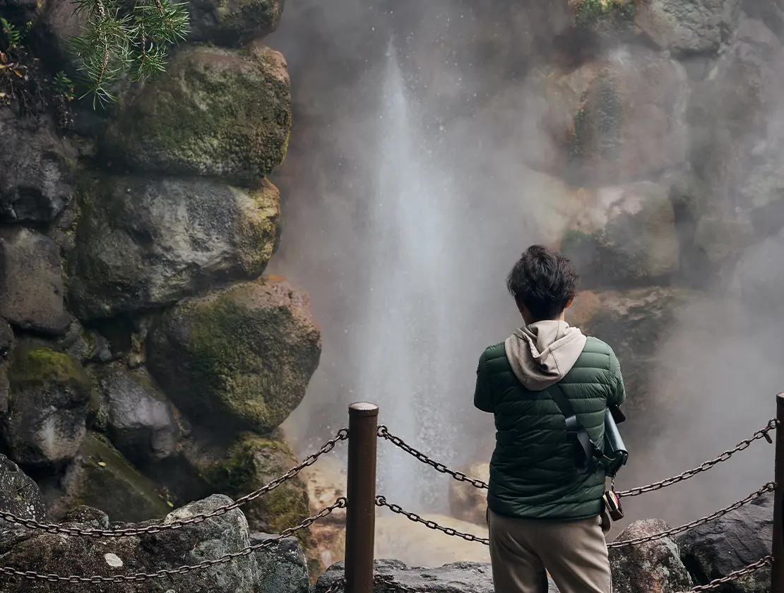 Person in front of a hot spring